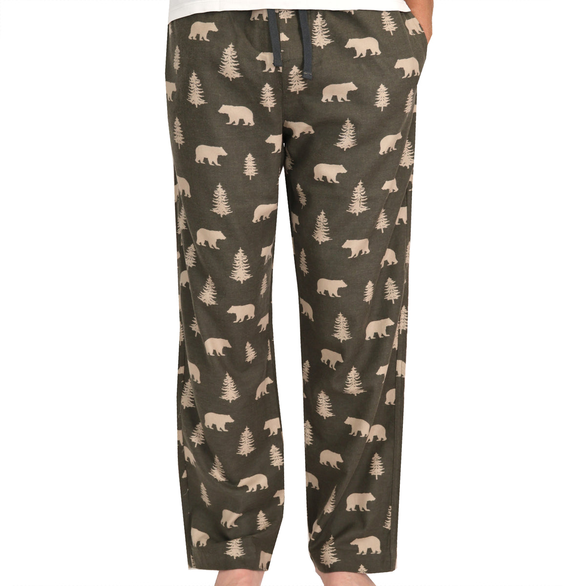 A pair of men's lounge pants featuring an all-over print of beige bears and pine trees on an olive green background, shown on a model against a white studio background.