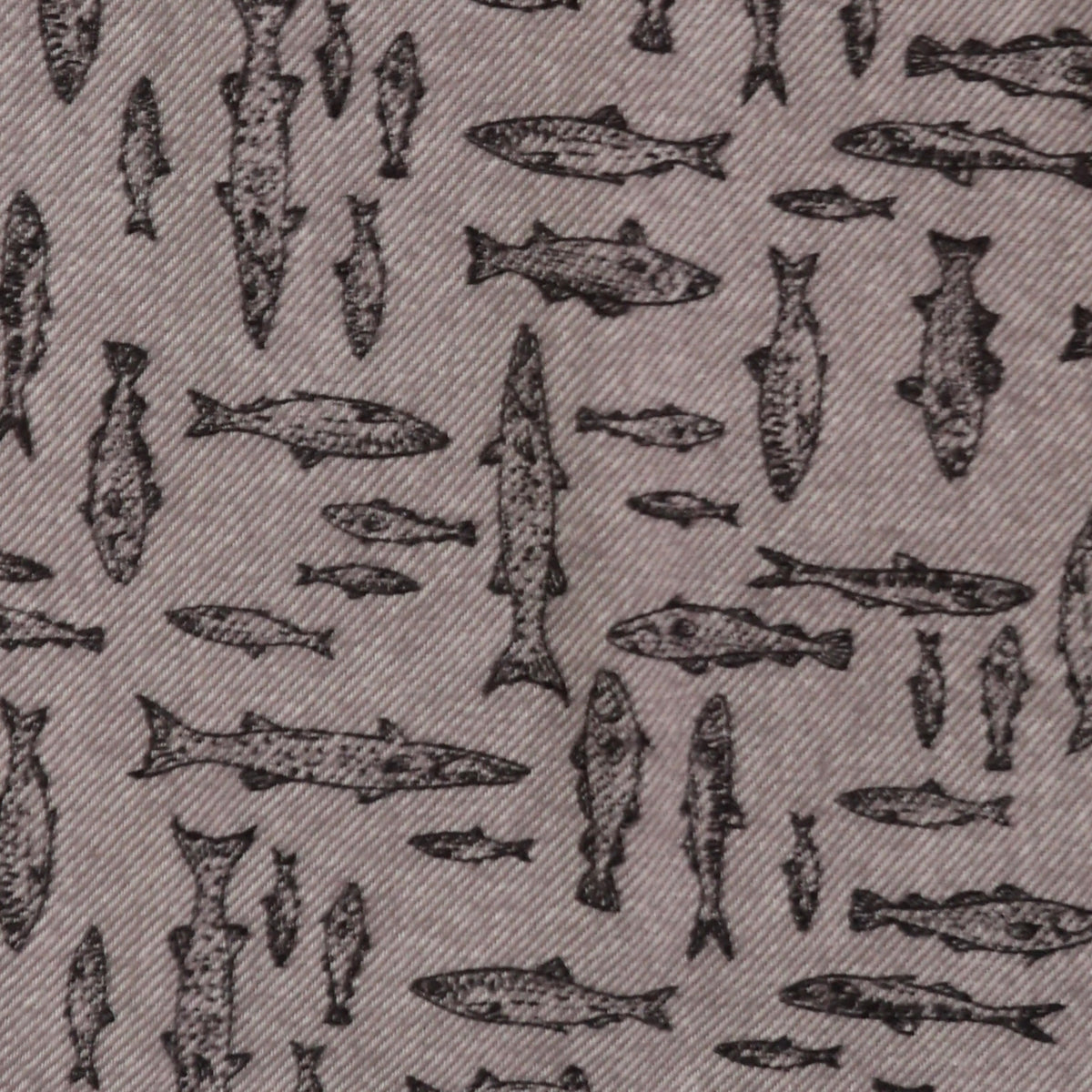 A close-up of a woven fabric with a repeating pattern of dark gray fish illustrations on a taupe-gray background.