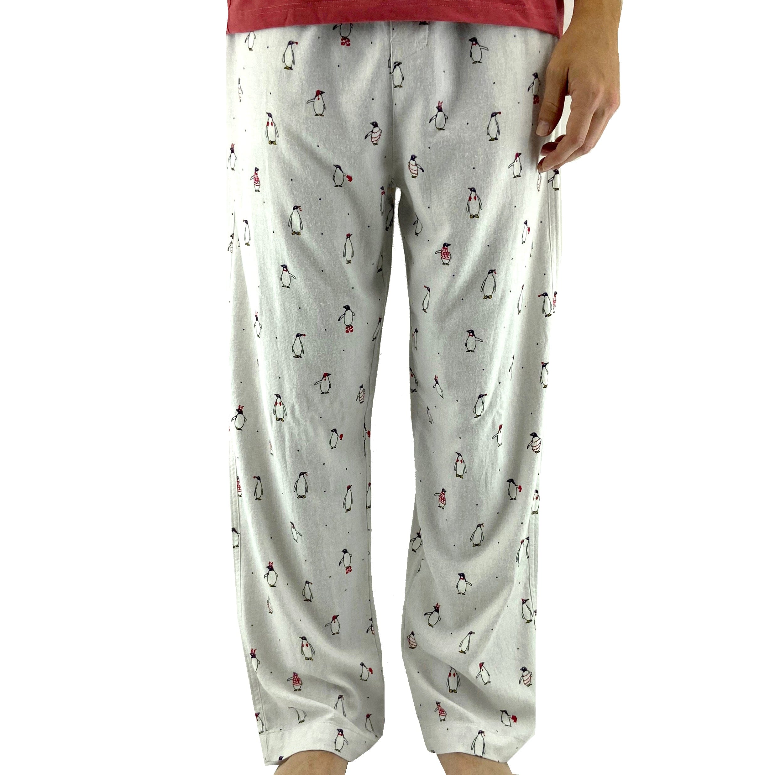 A pair of light grey pajama pants with a small all-over penguin print and red trim on the pockets and waistband. The pants have a relaxed fit and side pockets.