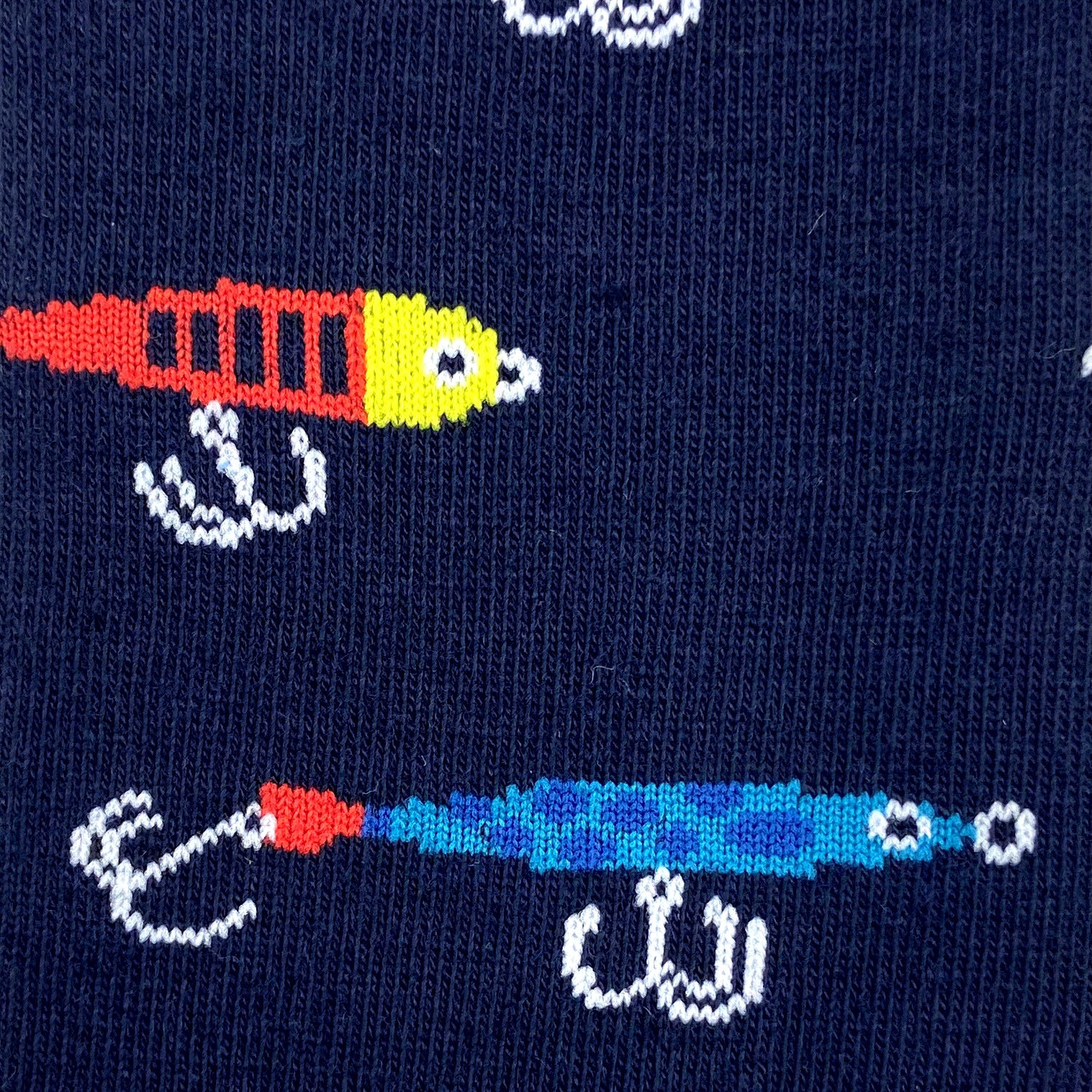 https://www.rockatoll.com/cdn/shop/files/fishing-lure-bait-patterned-novelty-socks.jpg?v=1710837747&width=1517