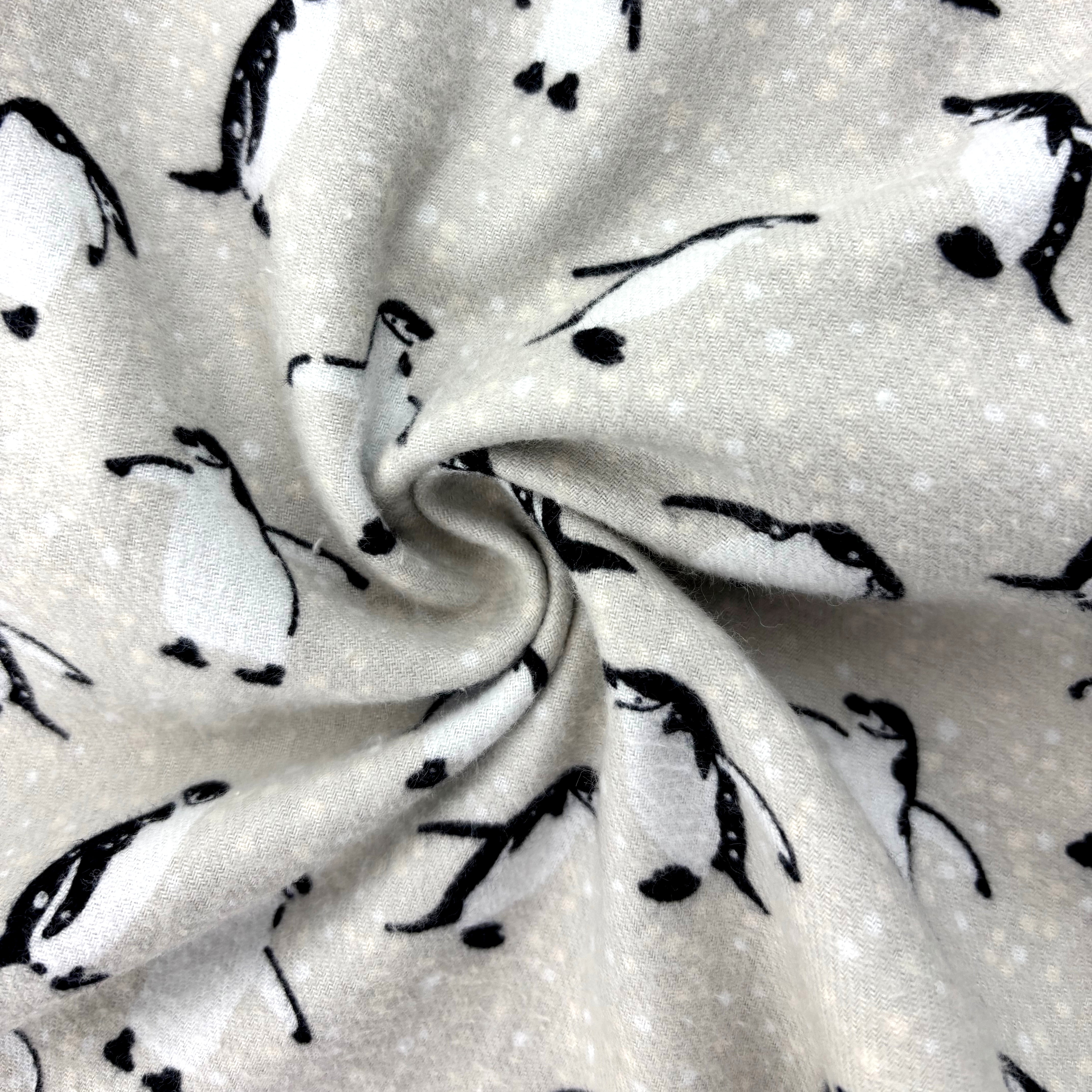 Fabric with penguin patterns on a light gray background
