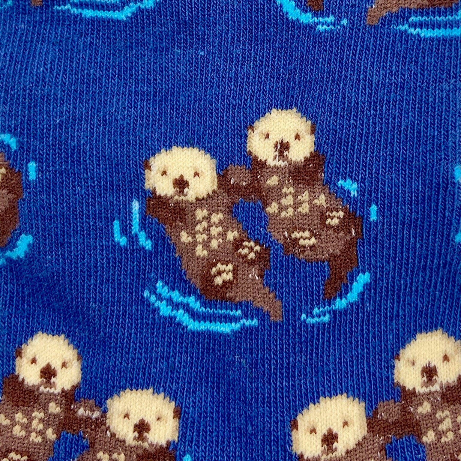 A Pair of Sea Otter Patterned Fun Unisex Novelty Crew Socks in Blue