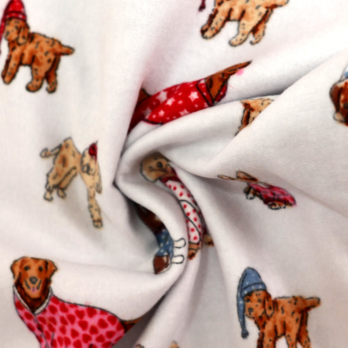 White fabric printed with a playful pattern of small dogs wearing red, pink, blue, and brown outfits, gathered in the center to show the material's drape and texture.