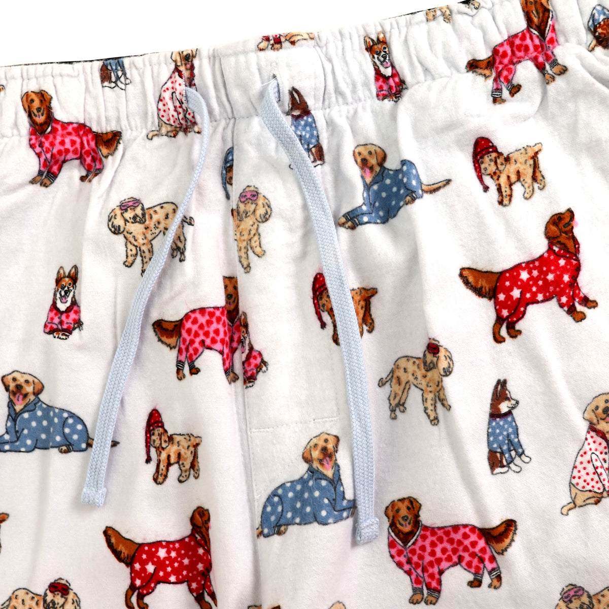 White drawstring shorts featuring an all-over print of dogs wearing red and blue sweaters, with a light blue drawstring.