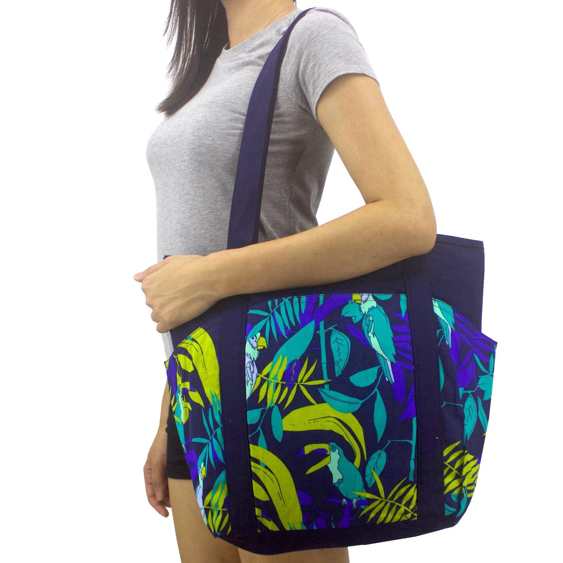 Pop this colorful tote over your shoulder and you'll be instantly channeling your inner cool chick vibes and it's not only because the bag is literally covered in a parrot and toucan print but mostly because you'll look so cool in it! You'll be amazed at how much you can fit into our classic weekend tote.