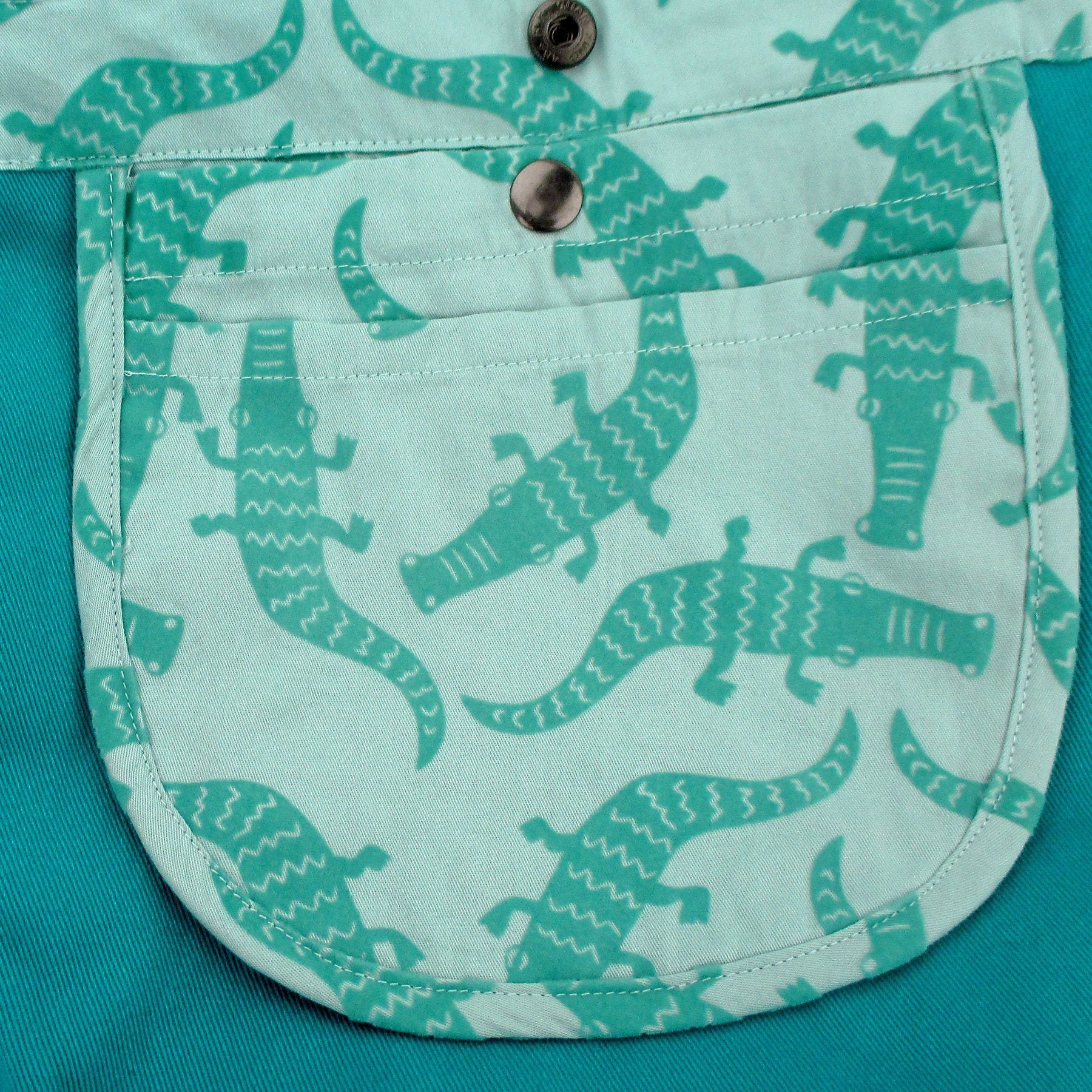 Throw this cute crocodile inspired cross body cotton bag on and express your love for them too! This is a limited edition print so make it snappy and add it to cart while stock lasts!